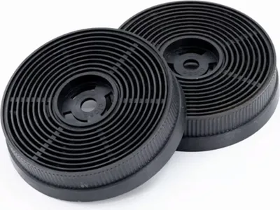 Two black circular carbon filters for a range hood.