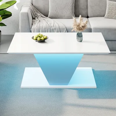 A modern white coffee table with blue LED lighting in a living room setting.