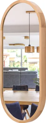 A mirror reflecting a dining room with a table and chairs, and a living room with a sofa and pendant lights.