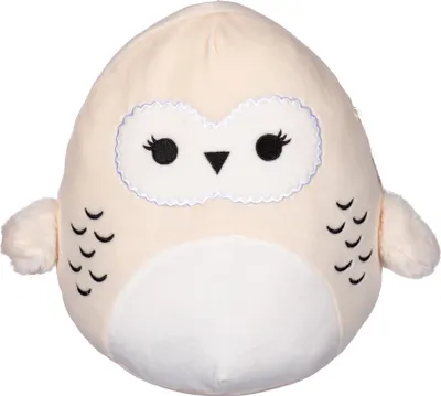 A plush toy owl on a white background.