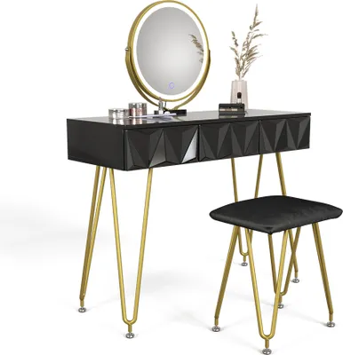 A black vanity table with gold legs, a round LED mirror, and a black stool, set against a white background.