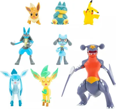 A collection of Pokémon figurines arranged on a white background.