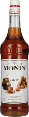 A bottle of Monin Caramel syrup.
