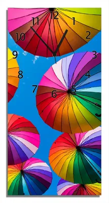 Produktbild von Wallario Design Wanduhr bedruckt, Größe 30 x 60 cm, Motiv: Bunte Regenschirme vor blauem Himmel
