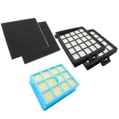 Several vacuum cleaner filters arranged on a white background.