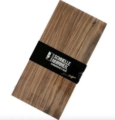 A wooden cutting board with a black band around it containing product information.