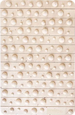 A close-up, overhead view of a tactile paving surface.