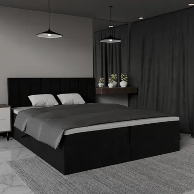 A bedroom scene with a black bed.