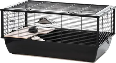 A hamster cage with accessories on a white background.