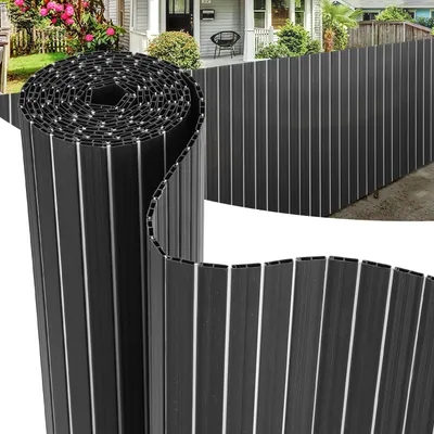 A rolled-up privacy screen is shown in the foreground, with a partially unrolled section extending into the background where it is installed as a fence.
