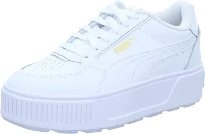 A white Puma sneaker with a platform sole.