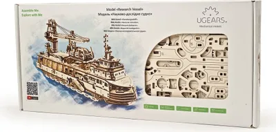 The image shows the packaging of a Ugears 3D mechanical wooden puzzle, specifically a research ship model. The box features an illustration of the assembled ship and a cutout revealing the wooden puzzle pieces inside.