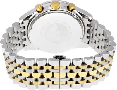The back of a two-tone watch with a metal band.