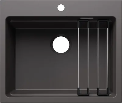 A top-down view of a dark gray kitchen sink with a circular drain and a small hole for a faucet. There are three silver racks with black bases inside the sink.