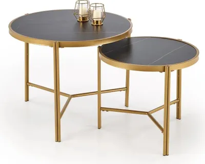 Two nesting tables with black marble tops and gold metal frames, displayed on a white background.