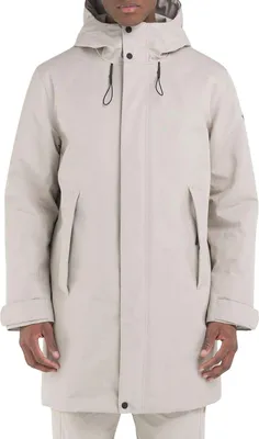 A man wearing a beige parka jacket.