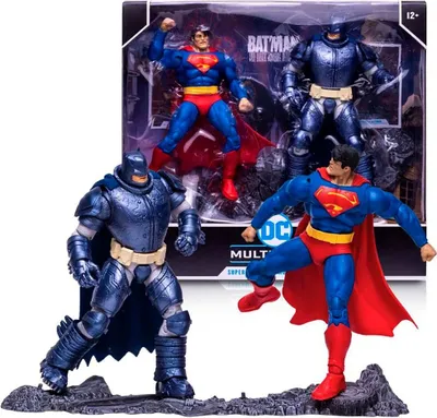 A collector's multipack of DC action figures featuring Superman and Armored Batman, displayed in their packaging and also outside of it.