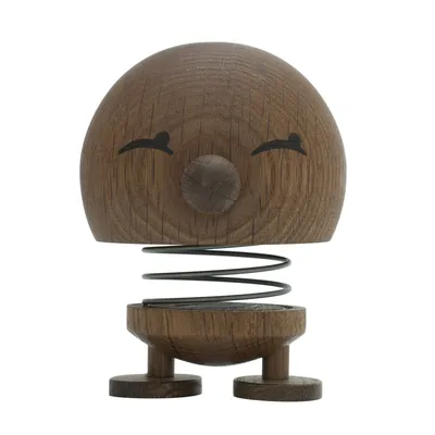 A wooden Hoptimist figure with a springy body and a smiling face.