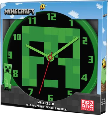 The image shows the packaging of a Minecraft wall clock. The clock face features a pixelated Creeper design with green hands and numbers on a black background. The packaging also includes Minecraft branding and illustrations of bees and clouds.
