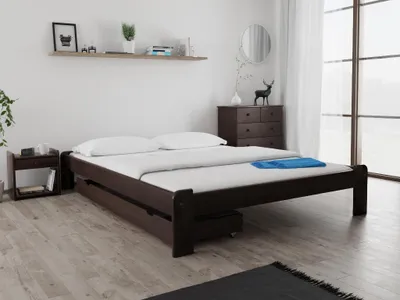 A bedroom scene with a bed and nightstand.
