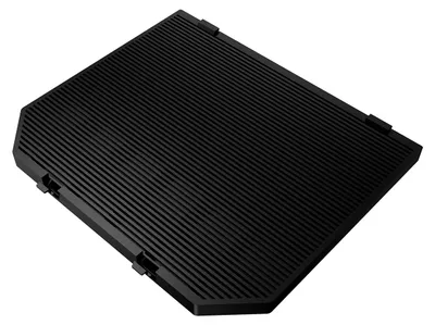 A black object with a ribbed surface lies on a black background.