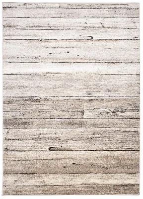 A close-up view of a rug with a wood plank design.