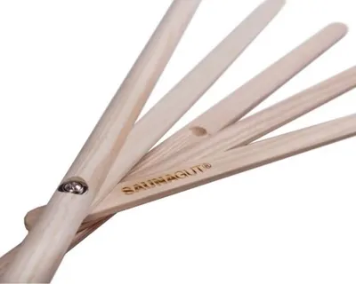A close-up shot of a wooden sauna whisk fan.