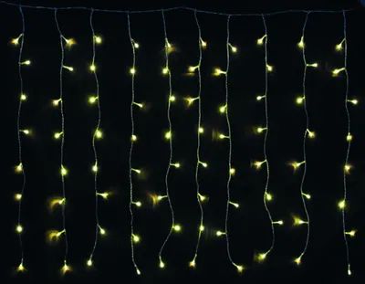 A string of warm white LED lights hanging vertically against a black background.