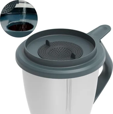 Close-up of a kitchen appliance lid with a sieve insert.