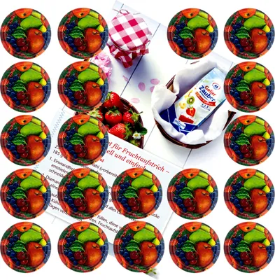 A collection of round fruit-themed stickers and a jar of jam with strawberries and a recipe booklet.