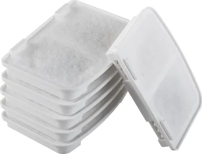 A stack of white pet water filter replacements and one filter detached from the stack.