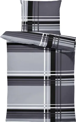 A folded duvet cover and pillowcase set with a graphic stripe pattern.