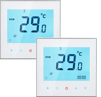 Two white digital thermostats are shown against a white background. The thermostats have blue screens displaying temperature and time.