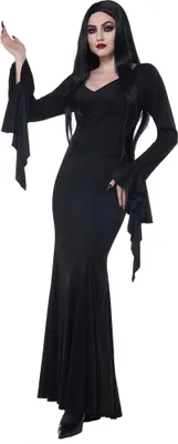 A woman wearing a black Morticia Addams-style costume.