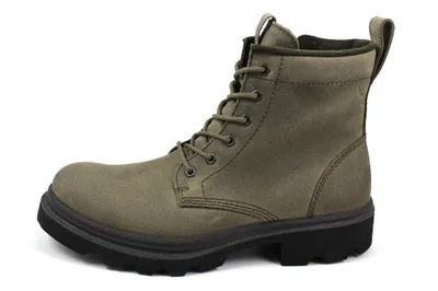 A single green boot is shown against a white background.