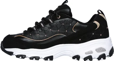 A side view of a black Skechers sneaker with gold accents and a white sole.