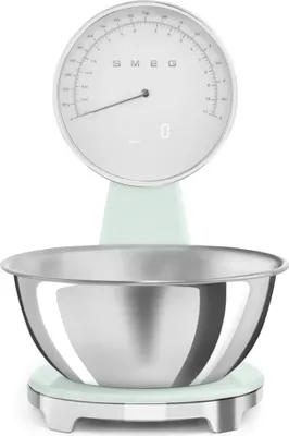 A Smeg electronic kitchen scale with a stainless steel bowl, shown from the front on a white background.