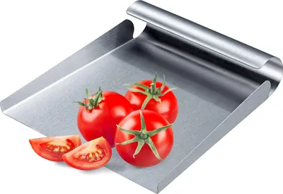 A stainless steel vegetable scoop with tomatoes on it.