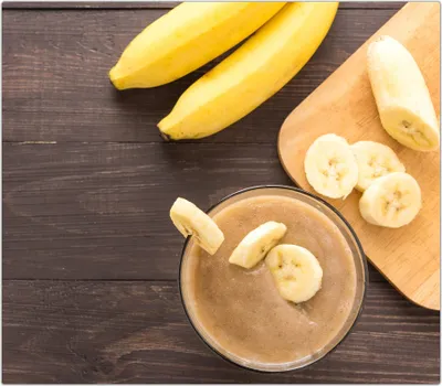 Produktbild von Spritzschutz Herdabdeckplatte Schneidebrett aus Glas Smoothie aus Bananen 1-Teilig (60x52cm)