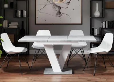 A dining room setting with a table and chairs.