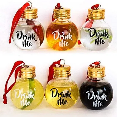 Six glass bottle-shaped Christmas ornaments filled with different colored liquids and a red ribbon for hanging.