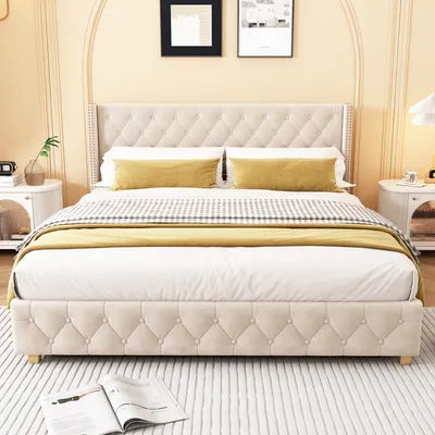 A bedroom scene featuring a tufted bed with yellow accent pillows and a throw blanket.