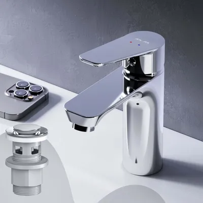 A chrome faucet and pop-up drain assembly on a white sink surface with a gray background.