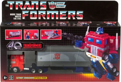 The image shows the packaging of a Transformers Optimus Prime action figure. The packaging is designed to display the product prominently, with the robot figure and its vehicle mode visible.
