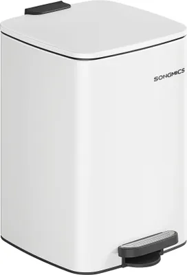 A white pedal trash can with a black pedal and lid accent.