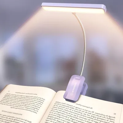 Immagine prodotto di Lampada da lettura con 26 LED - Lampada per libri con protezione per gli occhi - Comfortevole per la lettura - Intensità regolabile in modo continuo - Autonomia della batteria: 90 ore - Colore: viola