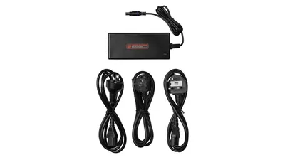 A black power supply unit with three black power cords arranged below it, all on a white background.