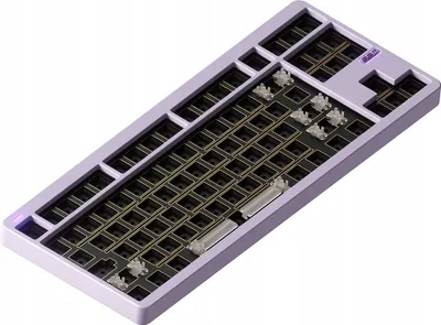A barebones mechanical keyboard kit with a purple case and black PCB.