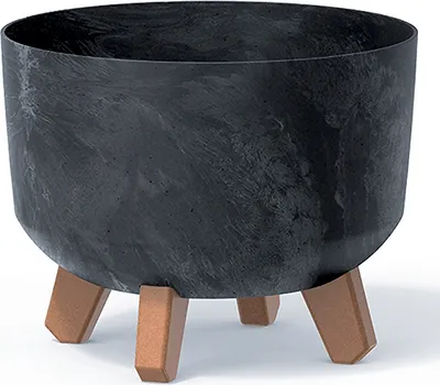 A dark, round planter with a marbled effect sits on three angled legs.