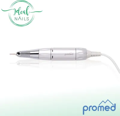 A white electric nail file with a silver tip rests on a white reflective surface against a white background. A green logo with the text "Ideal NAILS" is in the top left corner. The brand logo "promed" is visible on the product and in the bottom right corne